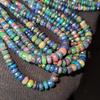 Faceted Rainbow Flashy Rondell Ethiopian Opal Beads, Healing Black faceted strand.