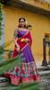 Step into timeless elegance with this Poly Chanderi lehenga, designed with delicate Zari stripes and enhanced