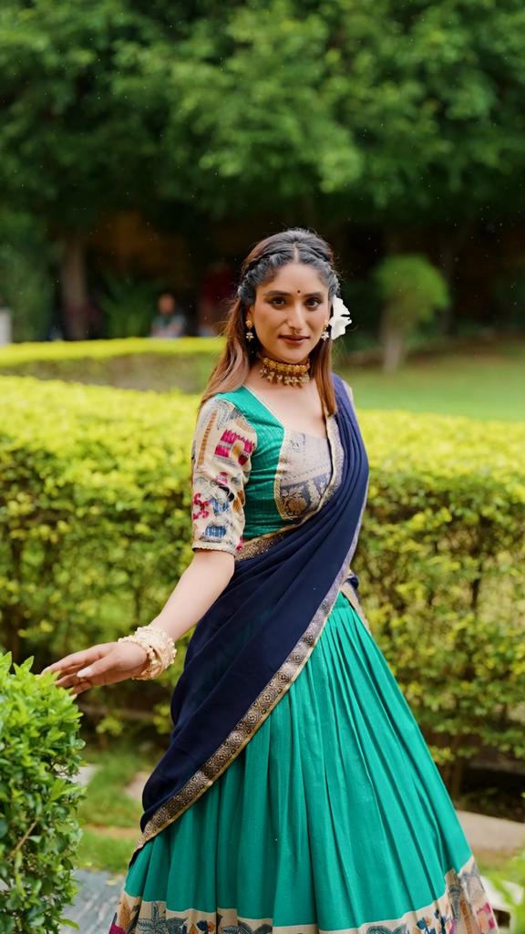 Step into timeless elegance with this Poly Chanderi lehenga, designed with delicate Zari stripes and enhanced