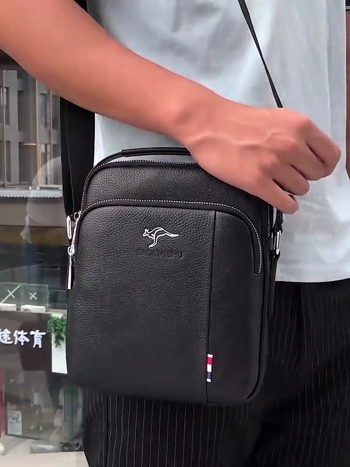 Die erste Schicht aus wasserdichtem und verschleißfestem Rindsleder mit großem Fassungsvermögen, koreanische Version der trendigen vertikalen Handtasche für Kunden