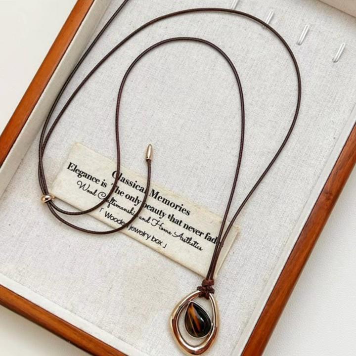 Irregular teardrop tiger's eye pendant necklace, vintage and unique.